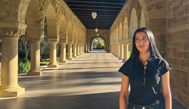 Woman standing in hallway at Stanford University